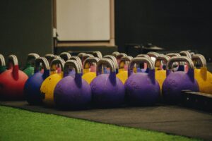 Return to center with kettlebells